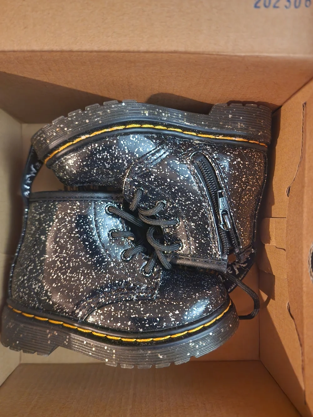 Dr. Martens Kids Black Speckle Ankle Boots with Yellow Stitching